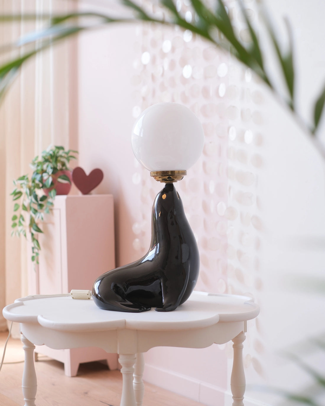 Ancienne lampe otarie en faïence et opaline